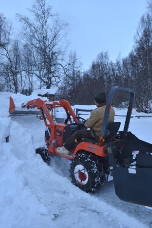 Pete clearing snow from the  arena